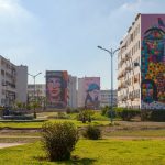 Casablanca, Morocco - January 20 2019: Housing Project in El Hank district with four of its buildings decorated with murals by Morrocan street artists. From left to right, "To the moon and back" by "Iramo", "Dream" by "Majid el Bahar", "Rebellous Teenager" by "Iramo" and "Dynam" and finally, "Mother Power" by "Okuda". The district of El Hank hosts many murals of this kind.